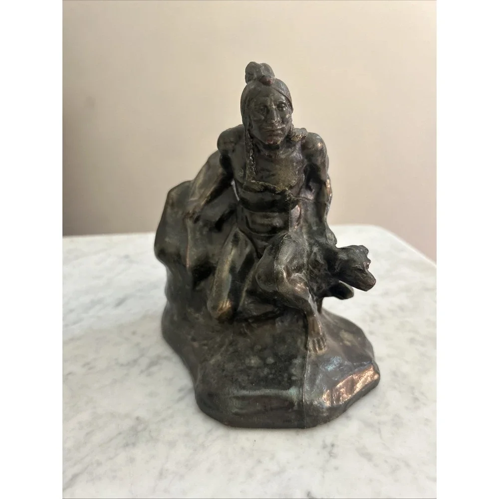 Antique Meal metal cast Indian bookends. Good condition.